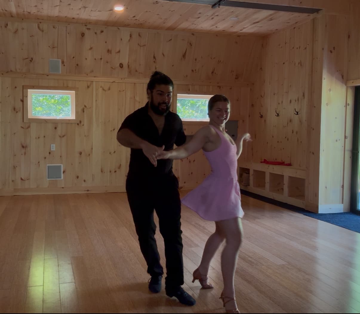 Doug teaching a ballroom lesson on a real studio floor.